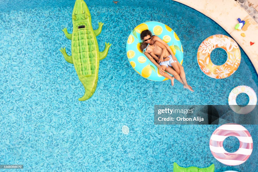 Mother with son on inflatable