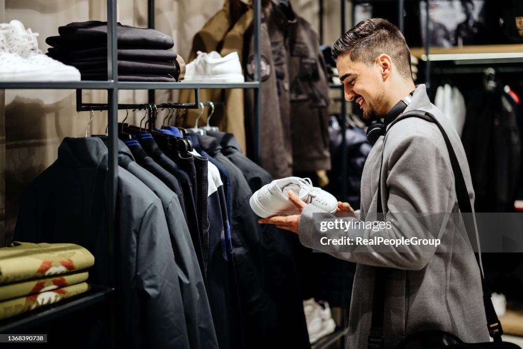 Young Businessman shopping in clothes store