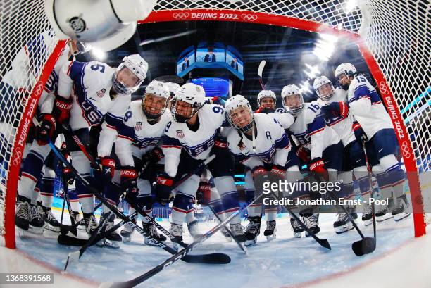 Team United States huddle before the start of the game during the Women's Ice Hockey Preliminary Round Group A match between Team United States and...