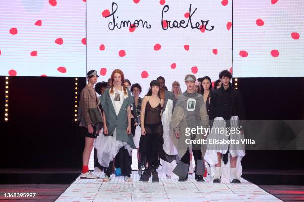 Anna Lou Castoldi and models walk the runway at the Simon Craker "Sulle corna della luna" fashion show during Altaroma 2022 at Cinecitta Studios on...