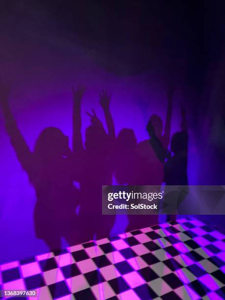 dancing in the neon light - retro dance party stock pictures, royalty-free photos & images