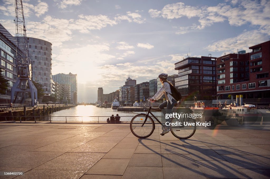 Young woman riding a bike