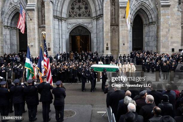 The casket of fallen NYPD officer Wilbert Mora is brought out of St. Patrick's Cathedral in Manhattan on February 2, 2022. Mora was fatally shot...