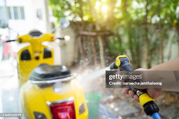 a man cleaning motorcycle - motorbike wash stock pictures, royalty-free photos & images