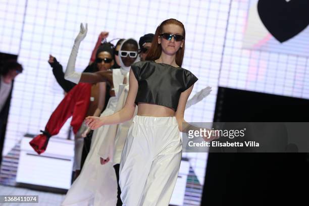 Models walk the runway at the Casa Preti "Innocenza" fashion show during Altaroma 2022 at Cinecitta Studios on February 03, 2022 in Rome, Italy.
