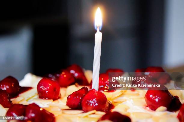 birthday candle - first light awards inside stock-fotos und bilder