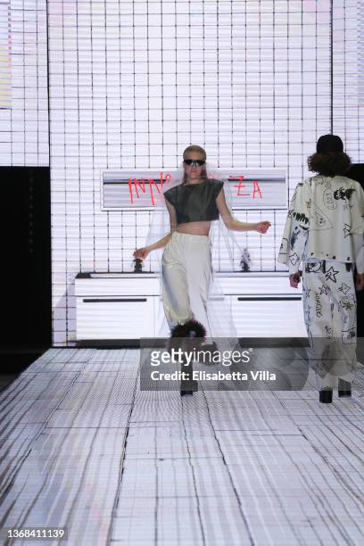 Model walks the runway at the Casa Preti "Innocenza" fashion show during Altaroma 2022 at Cinecitta Studios on February 03, 2022 in Rome, Italy.
