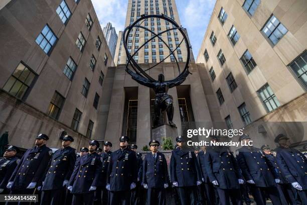 Police officers gather for the funeral of fallen NYPD officer Wilbert Mora across from at St. Patrick's Cathedral in Manhattan on February 2, 2022....