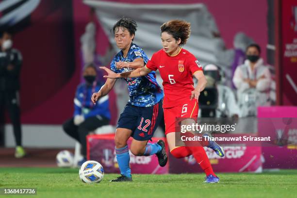 Zhang Xin of China and Ruka Norimatsu of Japan compete for the ball during the AFC Women's Asian Cup semi final between China and Japan at Shiv...