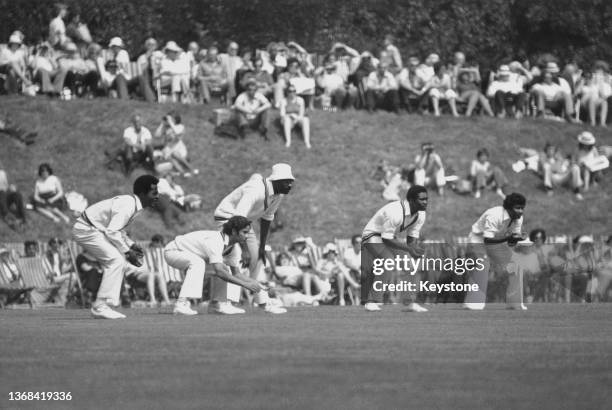 Spectators look on from the bank as Roy Fredericks, Larry Gomes, Clive Lloyd, Gordon Greenidge and Alvin Kallicharran of the touring West Indies...