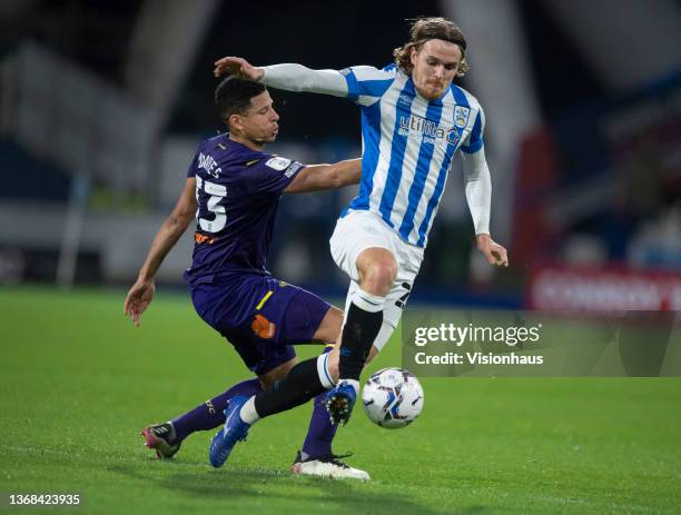 Danny Ward of Huddersfield Town and Curtis Davies of Derby County in action during the Sky Bet Championship match between Huddersfield Town and Derby...