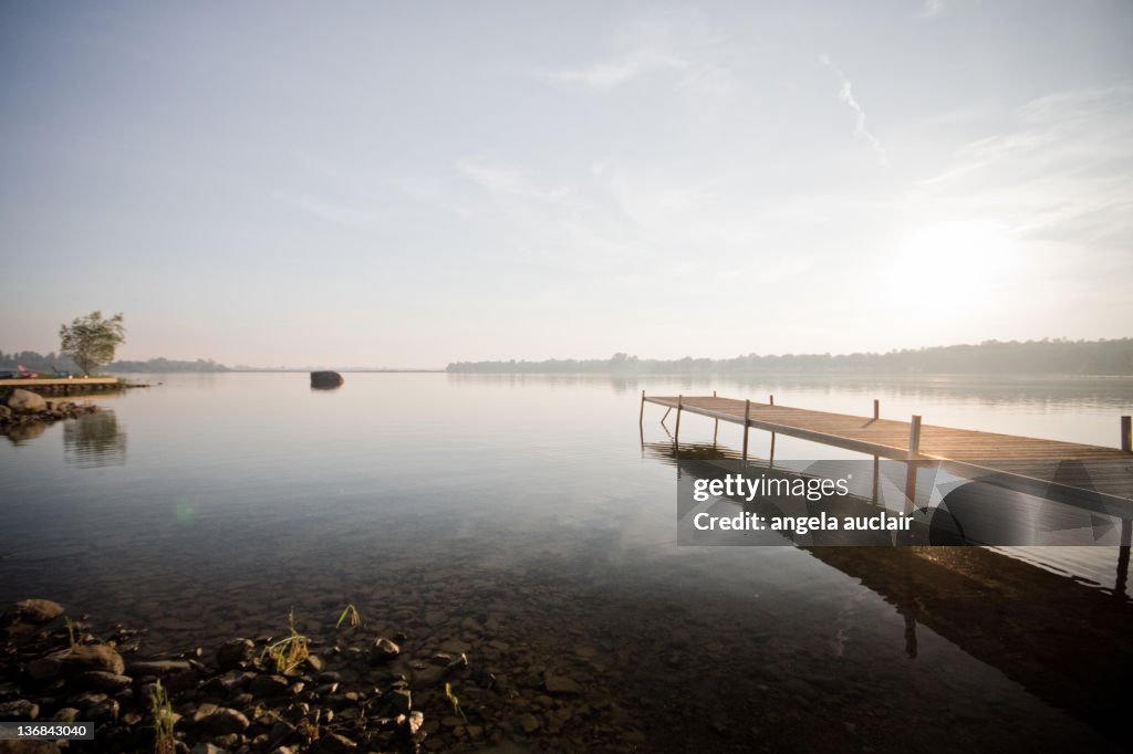 Long wooden dock at sunset