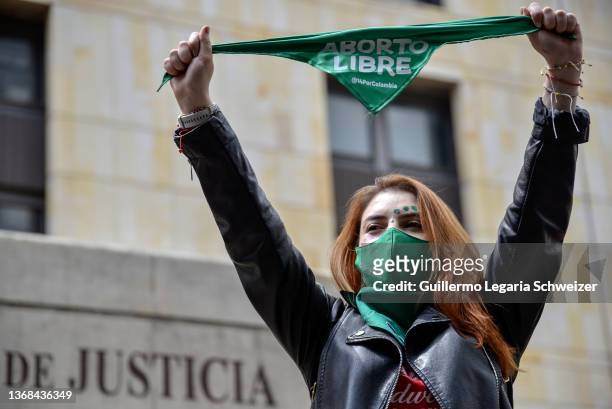 Pro-Choice demonstrator holds a green scarf that reads "Free abortion" outside the Justice Palace as Constitutional Court debate on the...
