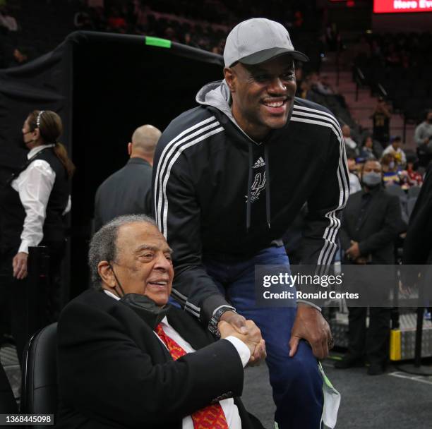 Andrew Young is honored at the San Antonio Spurs v Golden State Warriors game as former great David Robinson stopped to have his pictured taken with...