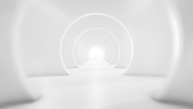Flying through the futuristic white tunnel. (Loopable) Abstract 3D animation. The concept of illuminated corridor, interior design, spaceship, science, lab, technology, science, architecture, industry