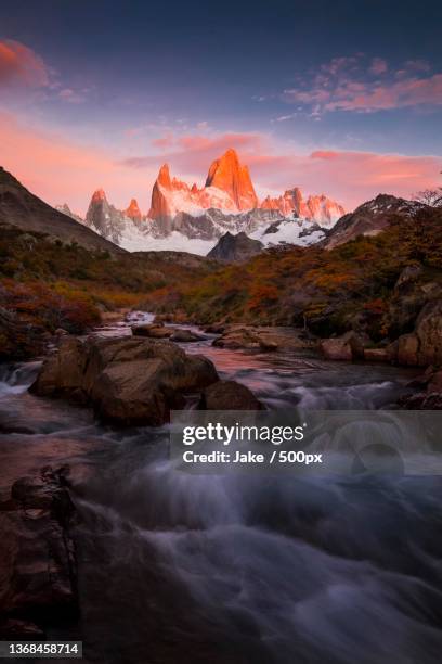scenic view of river against sky during sunset - the andes stock-fotos und bilder