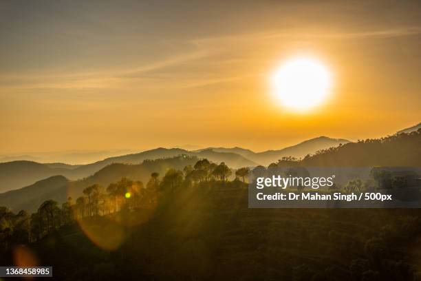 the untouched sunset,scenic view of mountains against sky during sunset,basudan,himachal pradesh,india - himachal pradesh stock pictures, royalty-free photos & images