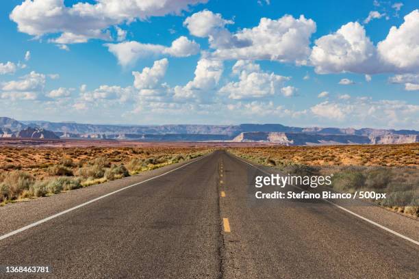 california on the road,empty road along countryside landscape,page,arizona,united states,usa - desert horizon stock pictures, royalty-free photos & images