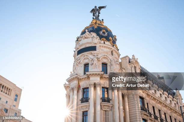 the metropolis famous monument in the center of madrid city. spain. - madrid stock pictures, royalty-free photos & images