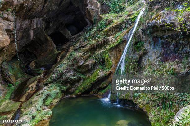 small waterfall at the grotte del caglieron,fregona,veneto,italy - fregona stock pictures, royalty-free photos & images