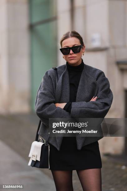 Aline Kaplan wearing black Celine shades, a grey Toteme jacket, a Maison Margiela bag on February 02, 2022 in Berlin, Germany.