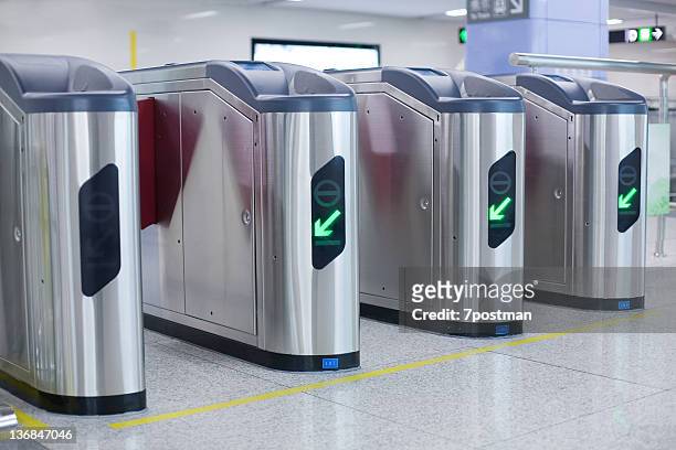 ticket validation machines - entering turnstile stock pictures, royalty-free photos & images