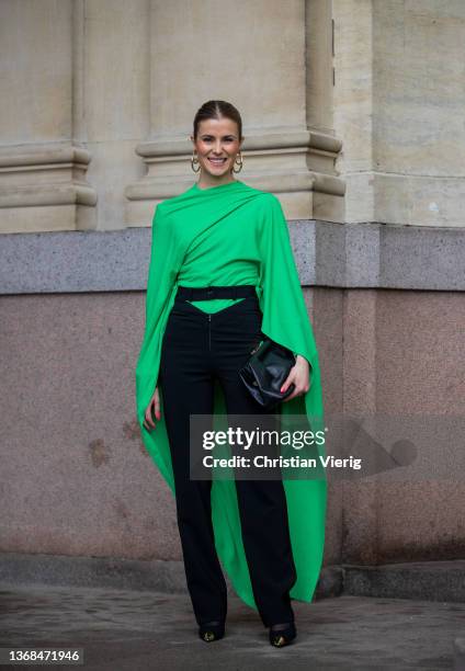 Nina Sandbech wearing green kimono top, high waist pants, earrings, black bag seen outside Mark Kenly Domino Tan during Copenhagen Fashion Week...