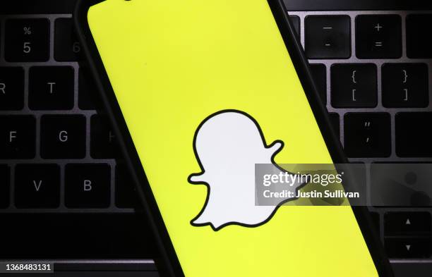 In this photo illustration, the Snapchat logo is displayed on a cell phone screen on February 03, 2022 in San Anselmo, California. Shares of Snapchat...
