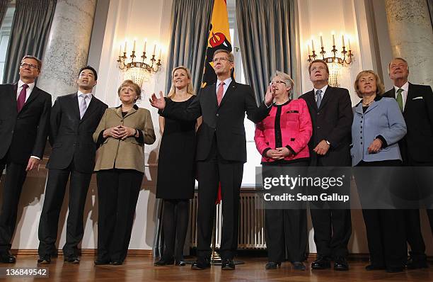 German President Christan Wulff and his wife Bettina Wulff receive members of the German government, including German Chancellor Angela Merkel , at...