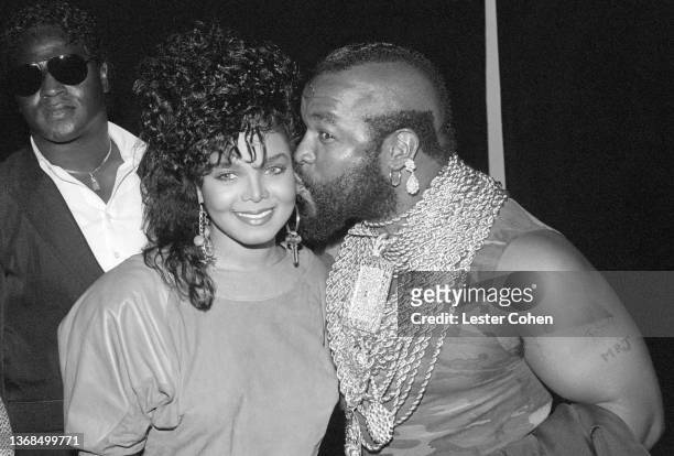American singer, songwriter, actress, and dancer Janet Jackson is kissed by American actor, television personality, and retired bouncer, bodyguard...
