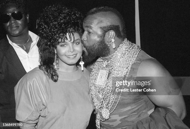 American singer, songwriter, actress, and dancer Janet Jackson is kissed by American actor, television personality, and retired bouncer, bodyguard...