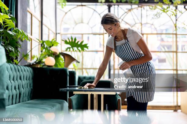 waitress cleaning the tables at a restaurant - food service occupation bildbanksfoton och bilder