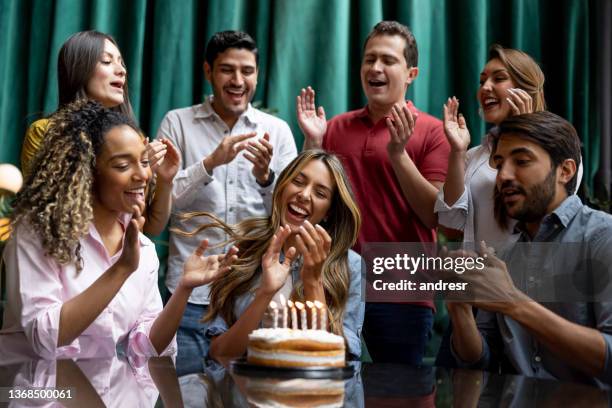 group-of-friends-singing-happy-birthday-to-a-woman-at-a-restaurant.jpg?s=612x612&w=gi&k=20&c=K28AZ5IkRjzW5fDFF2-YfPYUSwueF8A8uB5R3epAtCk=