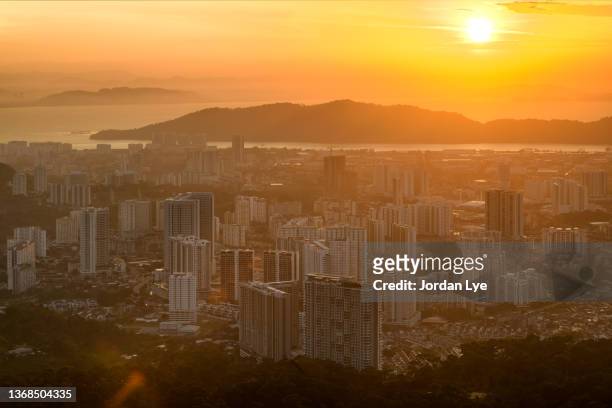 aerial view of bayan lepas skyline at sunrise - malaysia skyline stock pictures, royalty-free photos & images
