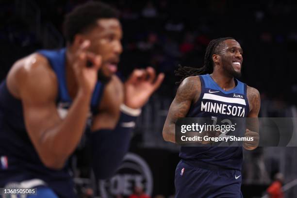 Taurean Prince of the Minnesota Timberwolves celebrates during the second half with Malik Beasley while playing the Detroit Pistons at Little Caesars...