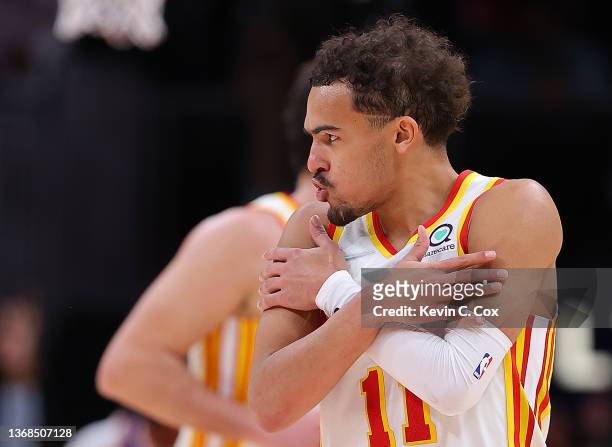 Trae Young of the Atlanta Hawks reacts after hitting a three-point basket against the Phoenix Suns during the second half at State Farm Arena on...