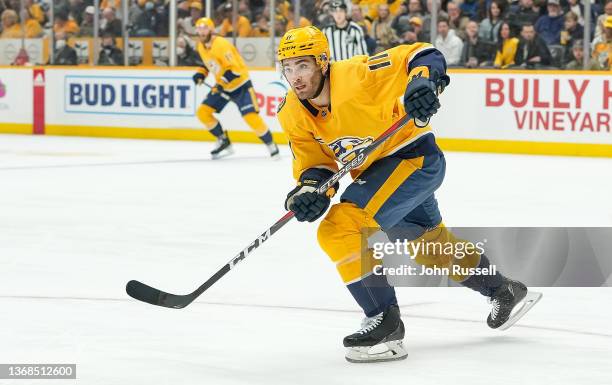 Luke Kunin of the Nashville Predators skates against the Vancouver Canucks during an NHL game at Bridgestone Arena on February 1, 2022 in Nashville,...