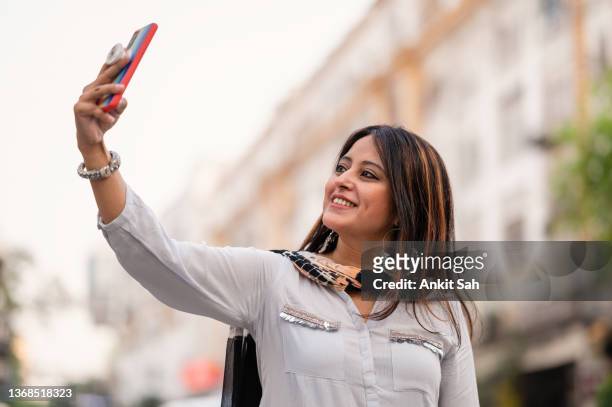 portrait  of happy young beautiful woman taking selfie. - free images without copyright stock pictures, royalty-free photos & images