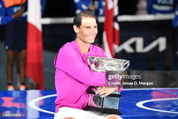 Rafael Nadal of Spain poses with the Norman Brookes Challenge Cup as he celebrates victory in his Men’s Singles Final match against Daniil Medvedev...