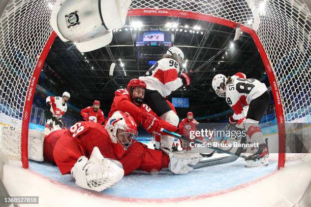 Diana Farkhutdinova of Team ROC dives to make a save against Phoebe Staenz of Team Switzerland in the third period during their Women's Preliminary...