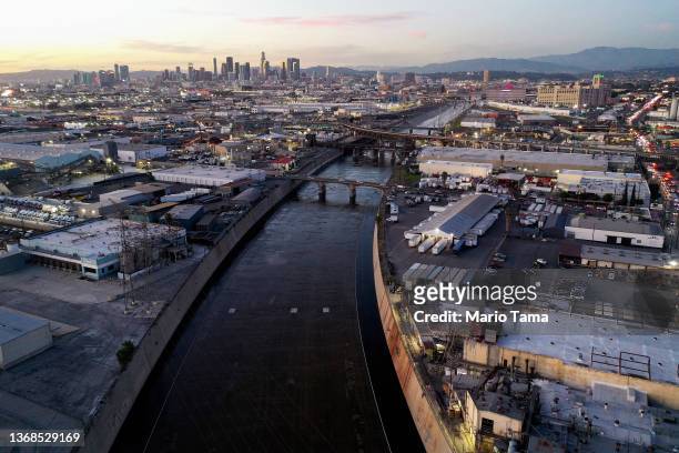 In an aerial view, the Los Angeles River flows near downtown L.A. On February 3, 2022 in Vernon, California. As climate change makes droughts more...