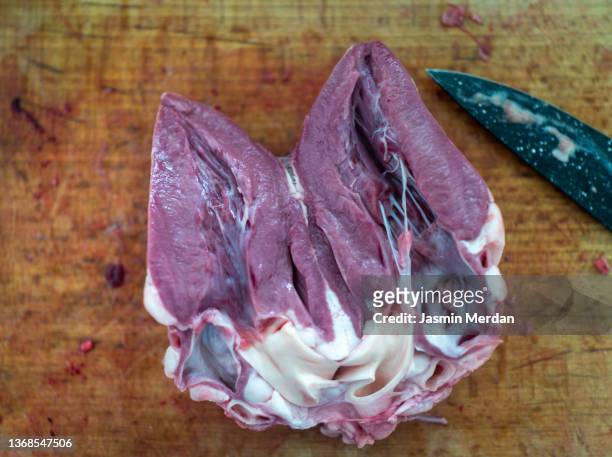 cutting meat of heart - sheep cut out stock pictures, royalty-free photos & images