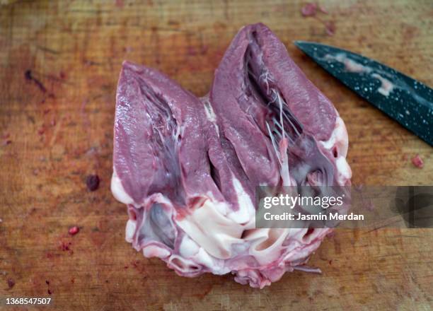 cutting meat of heart - fore arm stock pictures, royalty-free photos & images