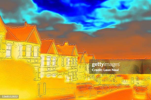 In this image made with a thermal camera, rows of houses show signs of heat loss on February 04, 2022 in London, England. The energy regulator Ofgem...