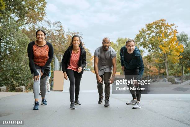 ambitious male and female friends lined up at starting in park - championship day four stock pictures, royalty-free photos & images