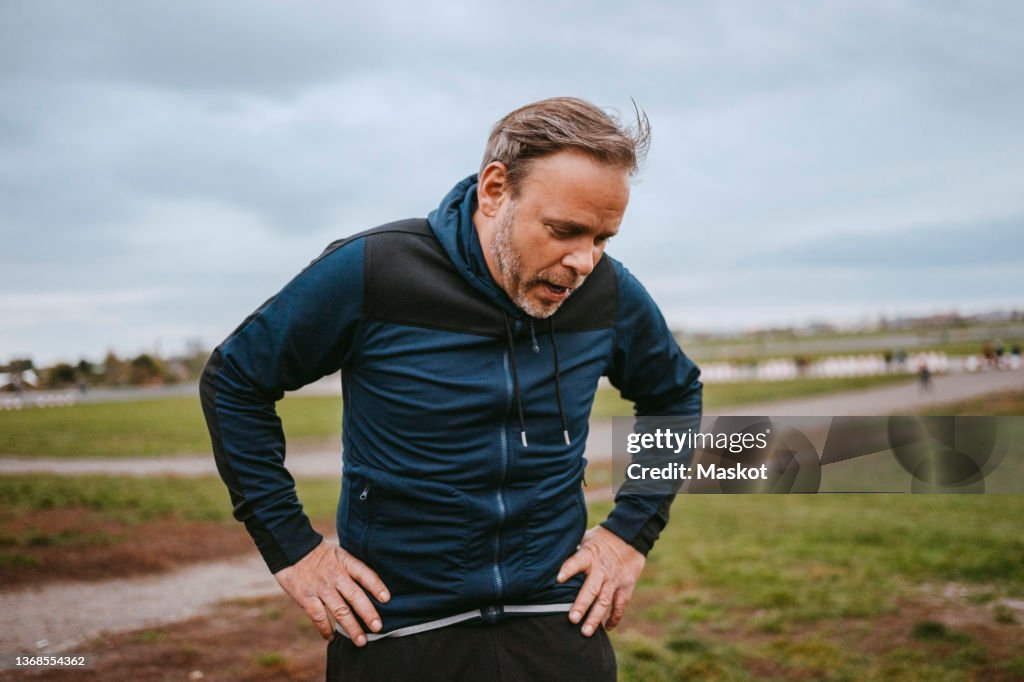Exhausted man taking break in park