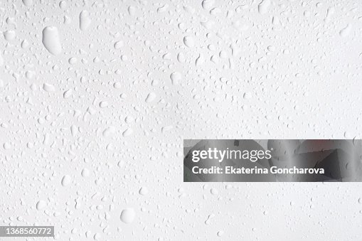 Abstract natural background of drops and splashes of water on a white background Abstract natural background of drops and splashes of water on a white background