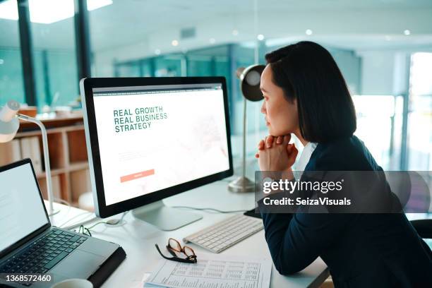 shot of a young businesswoman using a computer in a modern office at work - computer monitor stock pictures, royalty-free photos & images