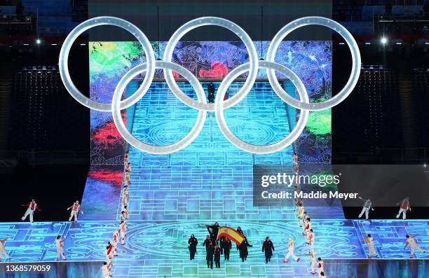 Flag bearers Queralt Castellet and Ander Mirambell of Team Spain carry their flag during the Opening Ceremony of the Beijing 2022 Winter Olympics at...