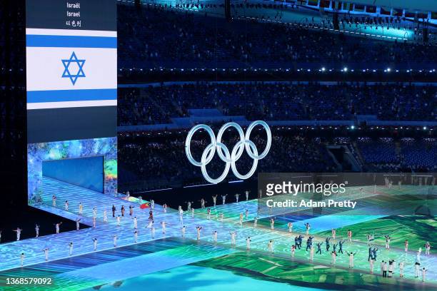 Flag bearers Evgeni Krasnopolski and Noa Szollos of Team Israel carry their flag during the Opening Ceremony of the Beijing 2022 Winter Olympics at...